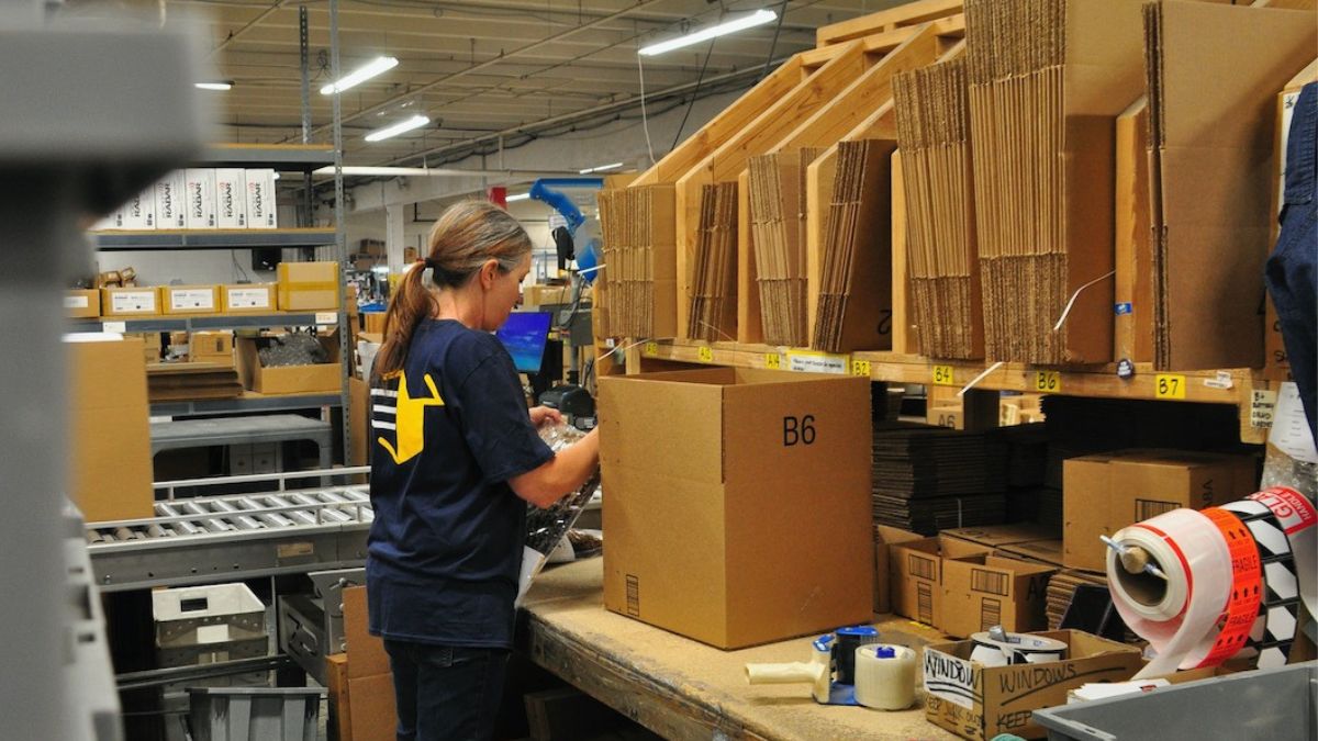 image of employees walking through warehouse
