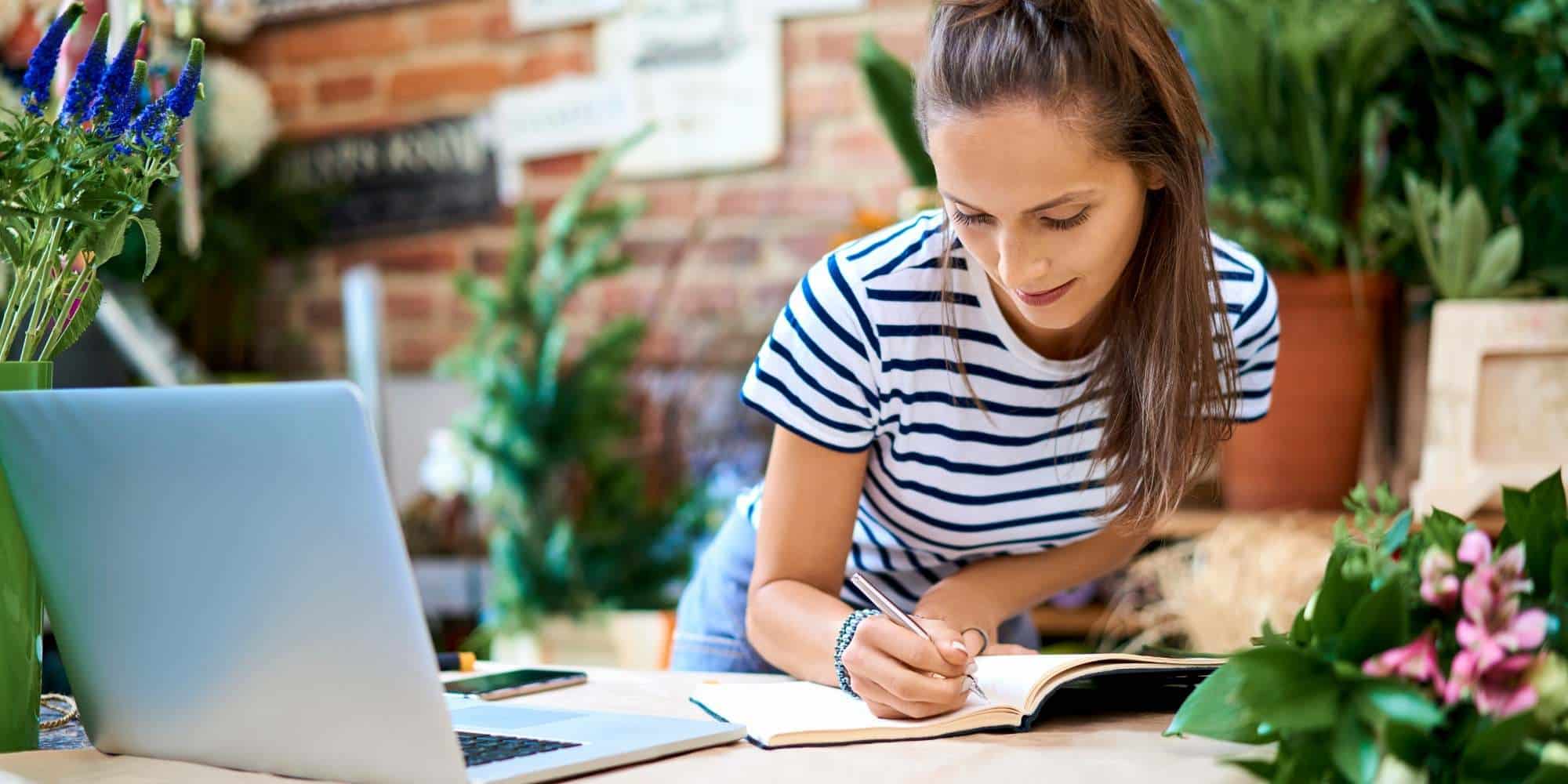 photo of person labeling a box on a desk