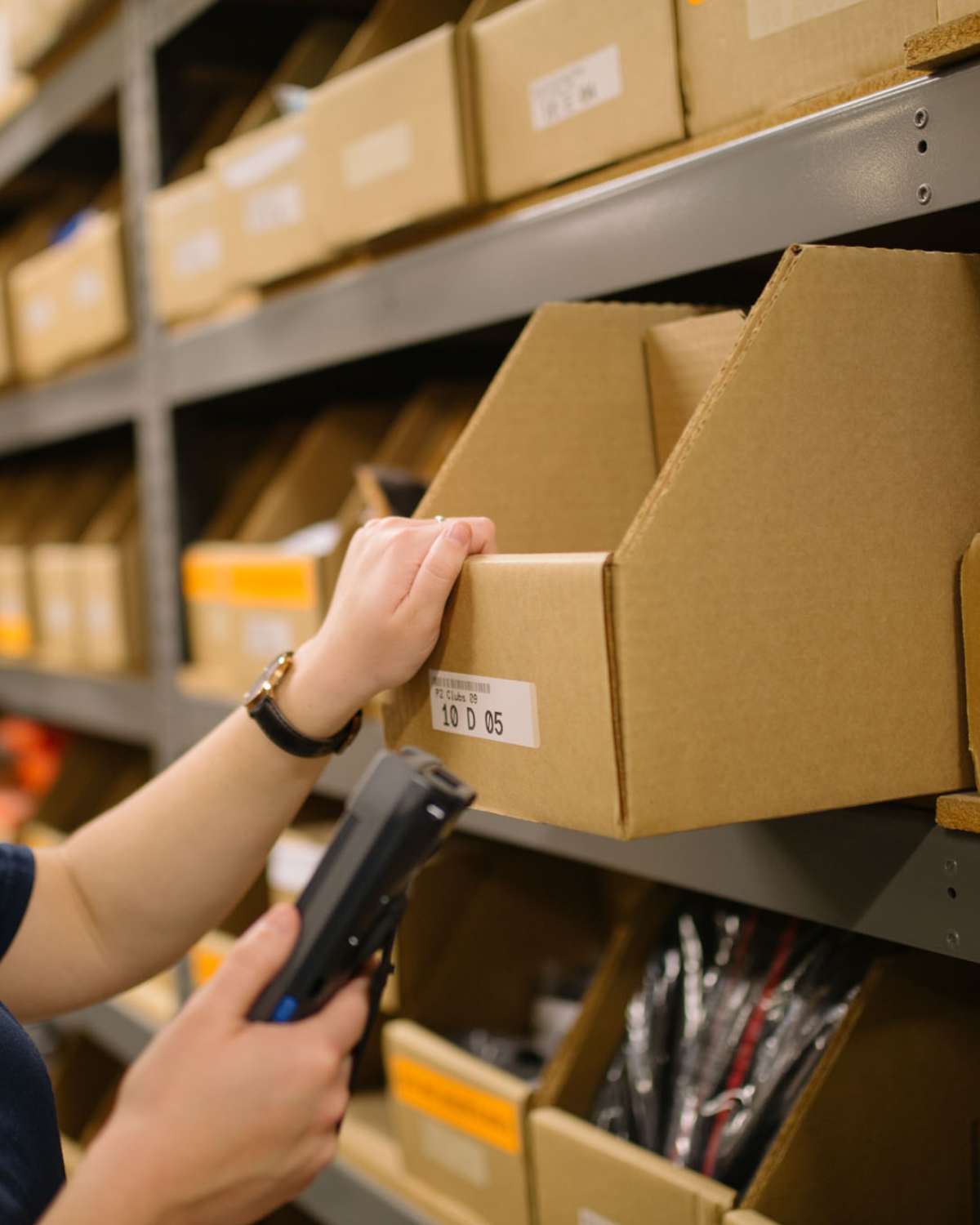 image of employee picking order out of box for FBM