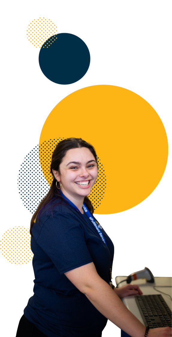 eFulfillment Service Employee at Scanner Station Many Dots