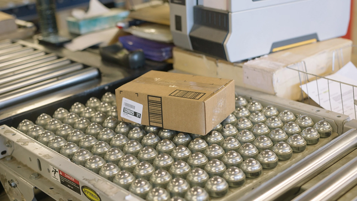 employee picking and packing item for shipment